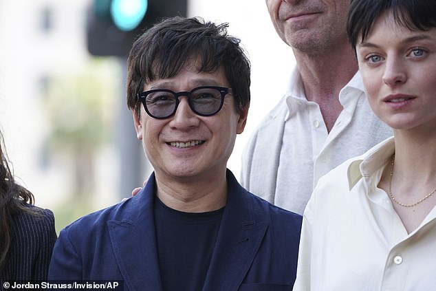 Oscar-winner Ke Huy Quan looked delighted as he posed with Emma Corrin