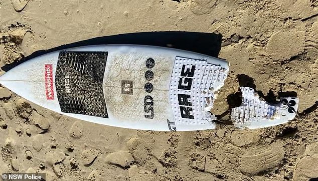 Mr McKenzie's surfboard is pictured following the horrific shark attack at North Shore Beach in Port Macquarie on Tuesday morning