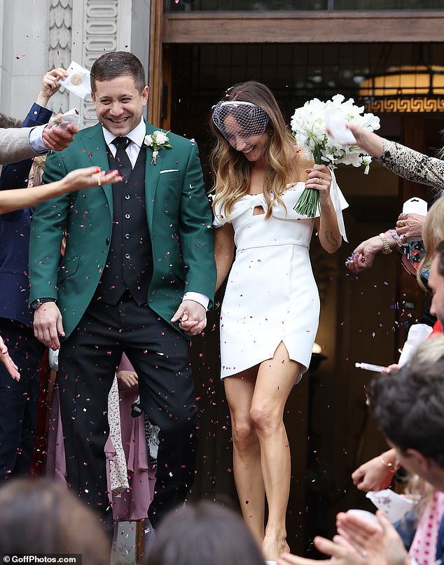 Guests threw confetti as the couple emerged from the town hall