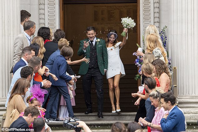 The guests lined the steps and cheered as the couple left