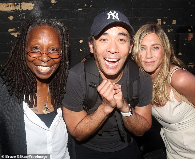 (L-R) Goldberg, a very excited Conrad Ricamora and Aniston huddle together