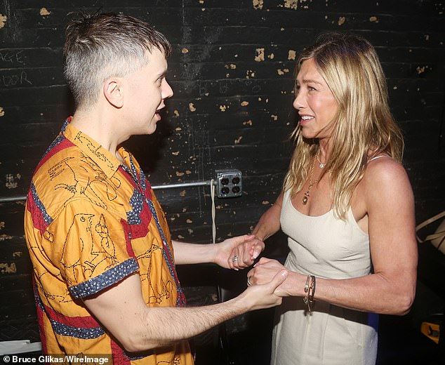 Cole held onto Jennifer's hands as she seemed to be a fan