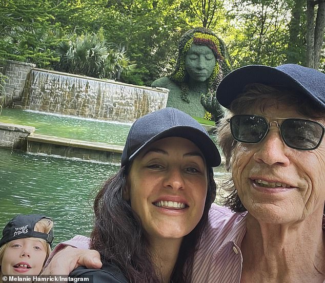 In another selfie they posed beaming happily with Deveraux, who proudly rocked a black Rolling Stones baseball cap