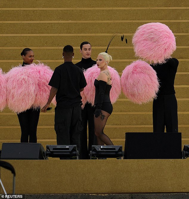 Gaga chatted with the crew during a break in rehearsals