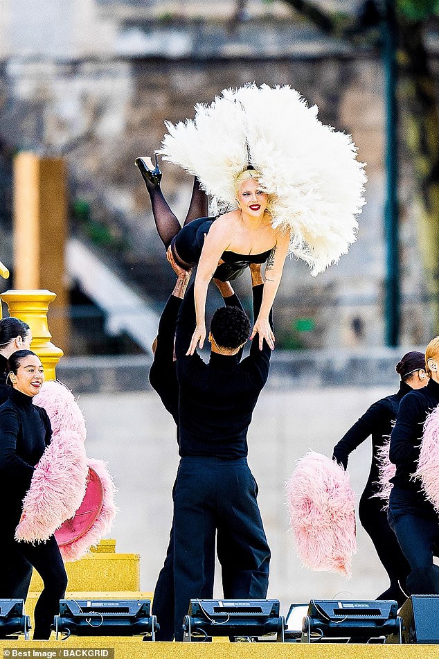 Lady Gaga, 38, put on a dramatic display as she rehearsed for the Olympics Opening Ceremony on the banks of the River Seine in Paris on Friday