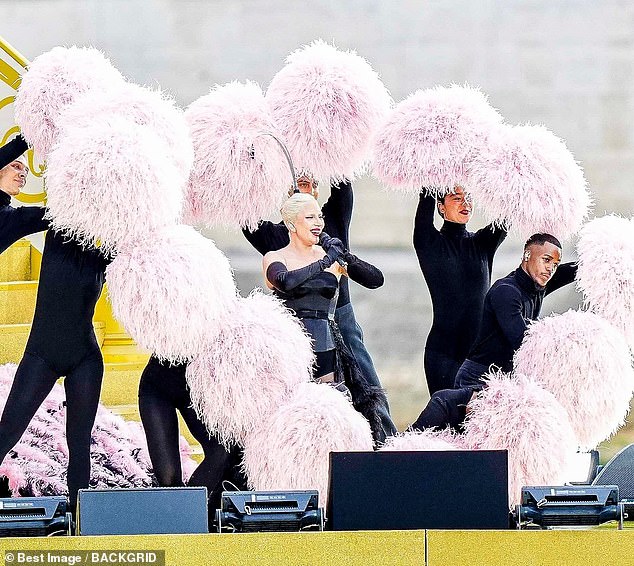 The dancers surrounded her for dramatic effect