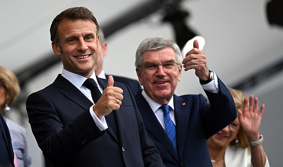 Emmanuel Macron, President of France, alongside Thomas Bach, President of the International Olympic Committee, ahead of the opening ceremony of the Paris 2024 Olympic Games. Picture date: Friday July 26, 2024. PA Photo. Photo credit should read: Joel Marklund/Pool//PA WireRESTRICTIONS: Use subject to restrictions. Editorial use only, no commercial use without prior consent from rights holder.