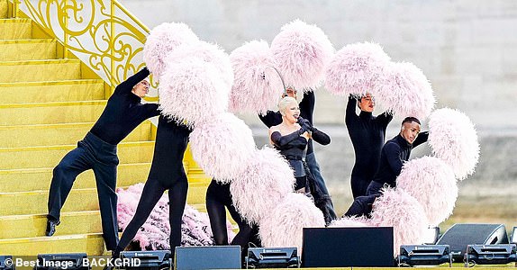 BGUK_2985735 - Paris, FRANCE  - The American Singer Lady Gaga performs during the opening ceremony of the Paris 2024 Olympic Games on the Seine River in Paris, France.  Pictured: Lady Gaga  BACKGRID UK 26 JULY 2024   BYLINE MUST READ: BEST IMAGE / BACKGRID  UK: +44 208 344 2007 / uksales@backgrid.com  USA: +1 310 798 9111 / usasales@backgrid.com  *Pictures Containing Children Please Pixelate Face Prior To Publication*