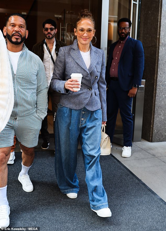 Jennifer Lopez looked happy as she left her hotel in New York City on Friday morning