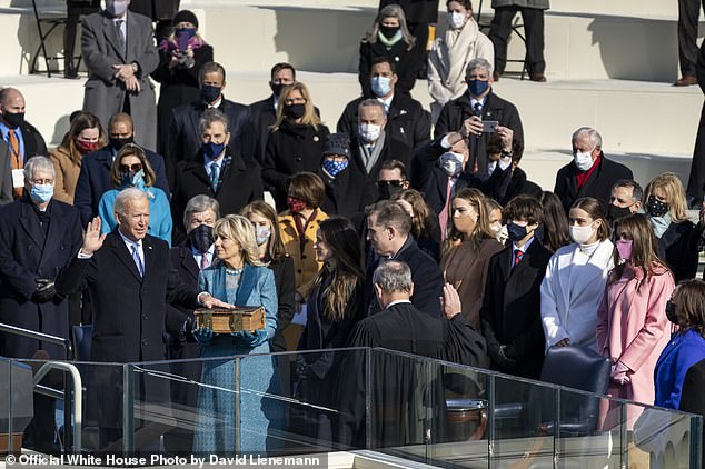 Biden, joined by Dr. Jill Biden, Ashley Biden, Hunter Biden and their grandchildren, is sworn in as President of the United States