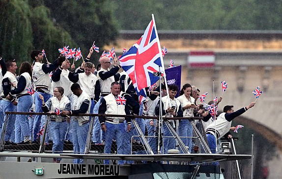 Great Britain flag bearers Thomas Daley and Helen Glover and the Great Britain Olympic team during the opening ceremony of the Paris 2024 Olympic Games. Picture date: Friday July 26, 2024. PA Photo. Photo credit should read: Pauline Ballet/Pool/PA WireRESTRICTIONS: Use subject to restrictions. Editorial use only, no commercial use without prior consent from rights holder.