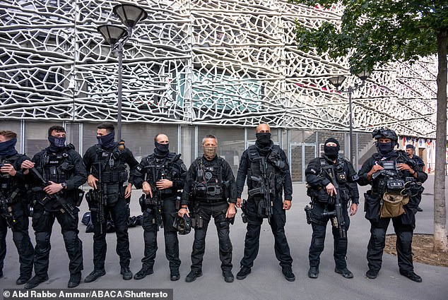 France has been on high alert over the past few weeks as preparations to host the Olympics hit the final stretch (pictured above: security at the Parc des Princes stadium in Paris on July 24)