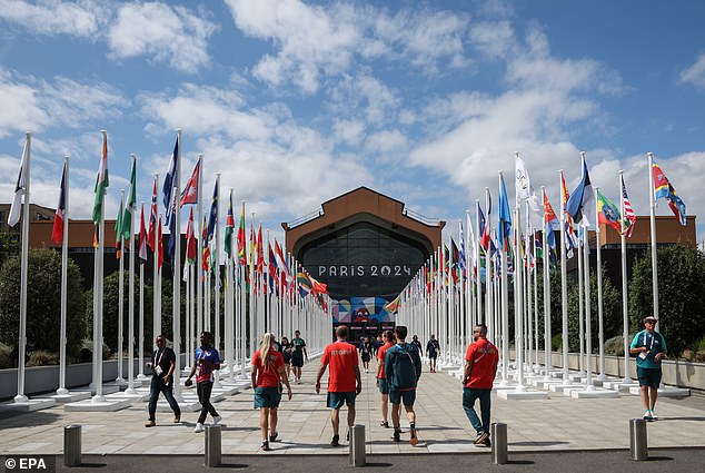 People walk in front of the Olympic village canteen at the Athletes' Village of the Paris 2024 Olympic Games in Saint Denis, France on Tuesday. The Summer Olympics are scheduled to take place from 26 July to 11 August 2024 in Paris