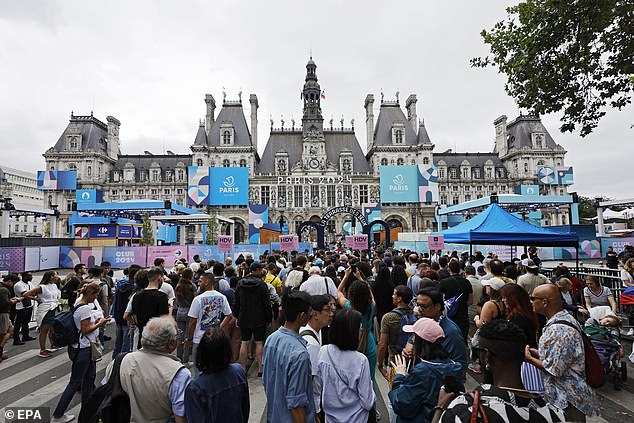 Spectators make their way through security checks ahead of the Opening Ceremony of the Paris 2024 Olympic Games, in Paris, France, 26 July 2024