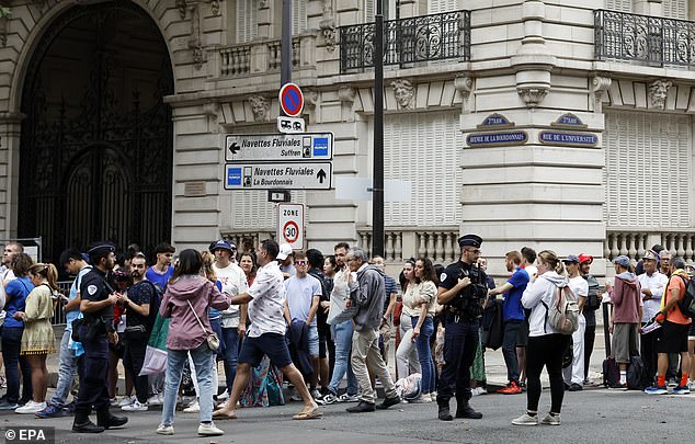 Spectators make their way through security checks ahead of the Opening Ceremony of the Paris 2024 Olympic Games, in Paris, France, 26 July 2024