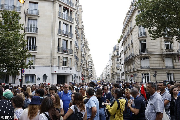 Spectators make their way through security checks ahead of the Opening Ceremony of the Paris 2024 Olympic Games, in Paris, France, 26 July 2024