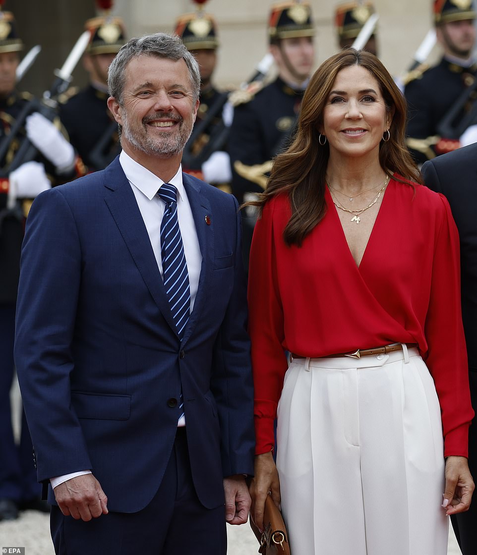 Putting on a chic display in a white gown and red blazer, Queen Mary of Denmark led the way in a striking crimson dress - as her husband opted for a navy suit