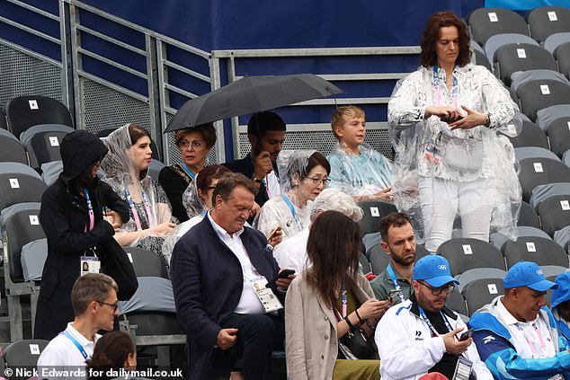 Spectators take their seats before the Olympics opening ceremony which will be held along the River Seine