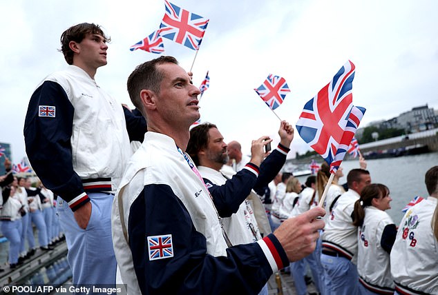 Andy Murray waves a flag during the Olympic Ceremony