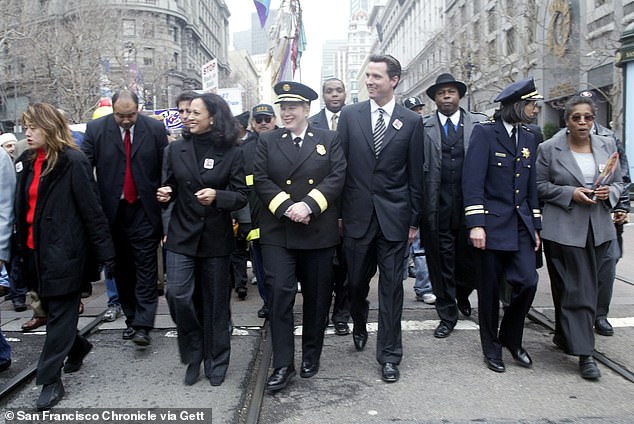 Kamala Harris, then San Francisco district attorney, and the city's then-mayor Gavin Newsom, and others walk in the Martin Luther King, Jr. Freedom March in 2004