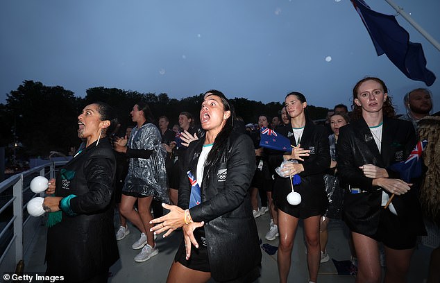 Team New Zealand embrace the rain as they perform the Haka