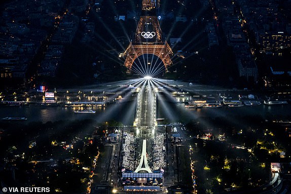 Paris 2024 Olympics - Opening Ceremony - Paris, France - July 26, 2024. An aerial view of the Eiffel Tower and the Olympics Rings lightened up during the opening ceremony of the Paris 2024 Olympic Games.  LIONEL BONAVENTURE/Pool via REUTERS