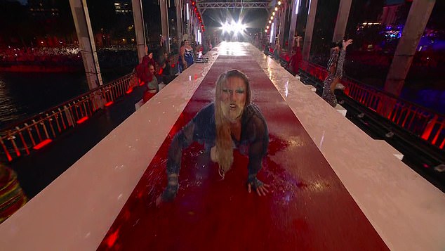 Dancers were forced to perform routines in the rain as they took boats down the Seine