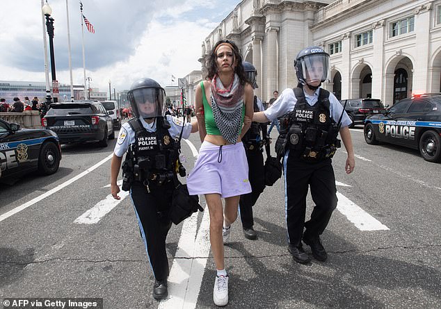 Police detain a Pro-Palestinian protester at Union Station