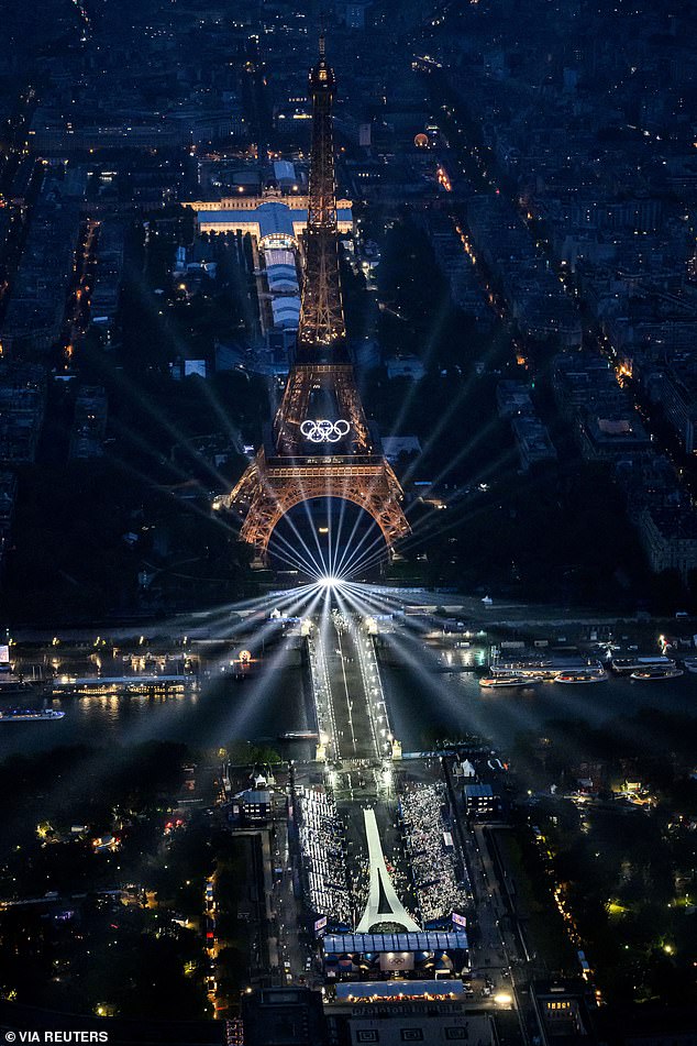 An aerial view of the Eiffel Tower and the Olympics Rings lightened up during the opening ceremony of the Paris 2024 Olympic Games.