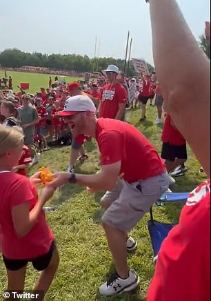 Kelce threw his gloves to her after practice