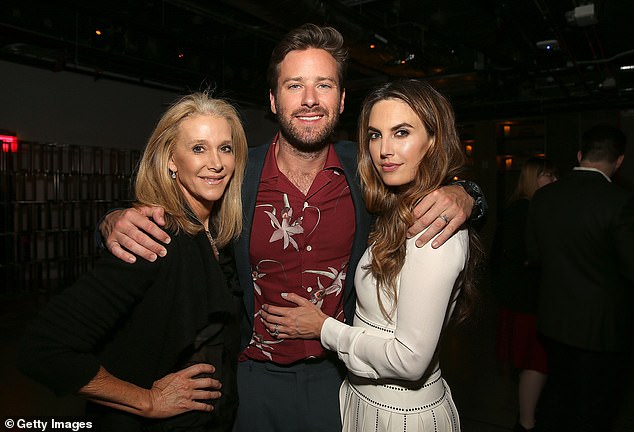 Referring to her son's recent interviews with Bill Maher and Piers Morgan, she said: 'He was not criminally wrong, he was morally wrong but it's changed his life forever and he's sober and he's happier than he's ever been ' - pictured 2017 with Armie's now ex-wife Elizabeth Chambers