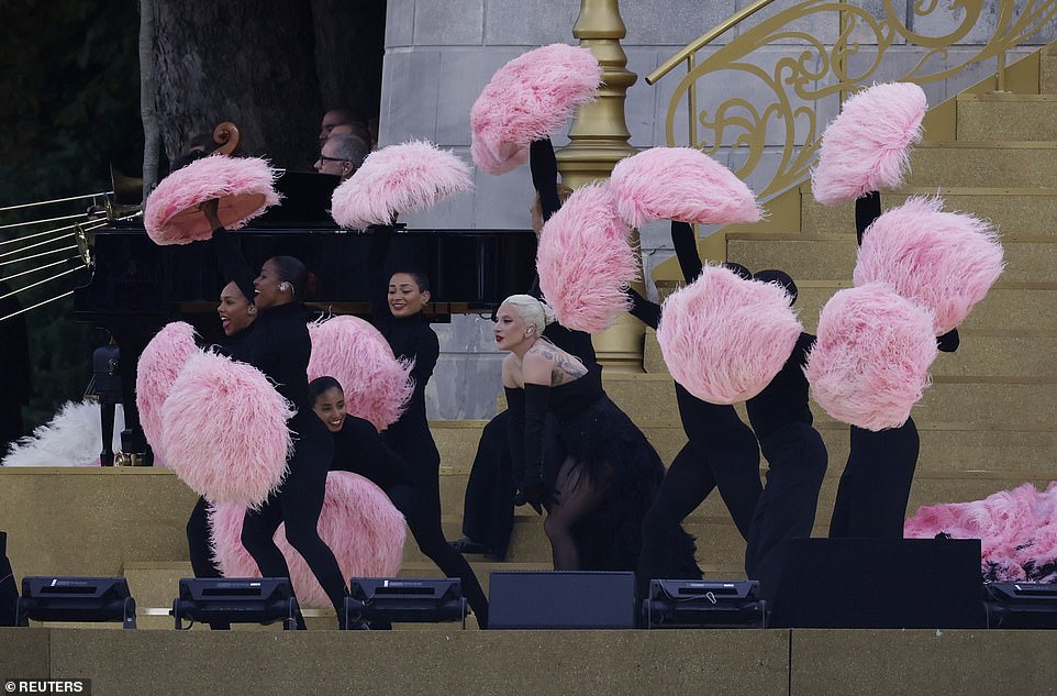 She sang entirely in French amid an plume of pink feathers