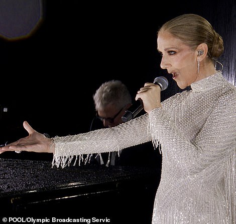 Despite the weather in France - which had left her piano soaking wet - the icon remained committed throughout as she made her big comeback