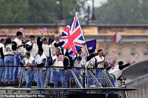 Great Britain flag bearers Thomas Daley and Helen Glover and the Great Britain Olympic team during the opening ceremony of the Paris 2024 Olympic Games. Picture date: Friday July 26, 2024. PA Photo. Photo credit should read: Pauline Ballet/Pool/PA WireRESTRICTIONS: Use subject to restrictions. Editorial use only, no commercial use without prior consent from rights holder.