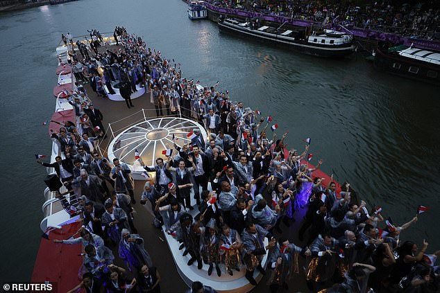 Athletes were brought up the River Seine in a flotilla of 85 boats as interpretive dance took place on the banks