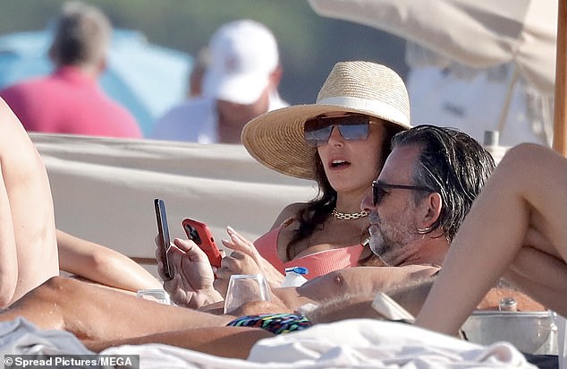 On Wednesday, the 53-year-old Real Housewives of New York City and sculptor, 46, looked flirty with one another as they soaked up the glorious weather and lounged on adjacent chairs