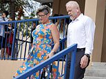 Jessica Norton, left, and her husband Gary leave Plantation High School after the Broward County School Board voted against firing her at a meeting in Plantation, Fla., Tuesday, July 30, 2024. Norton, who let her transgender daughter play on her high school's girls volleyball team was found to have violated state law and suspended by the board for 10 days. (Carline Jean/South Florida Sun-Sentinel via AP)