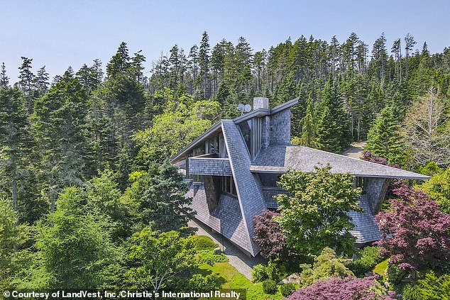 A captivating Frank Lloyd Wright- inspired home in Maine with rugged coastal views has hit the market for $5million (pictured)