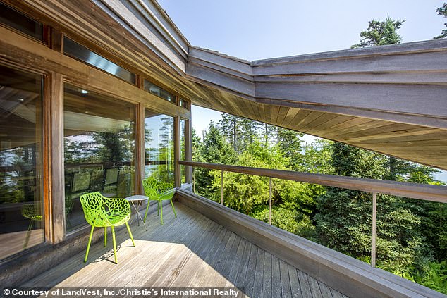 Schildroth drew inspiration for the home from the late Frank Lloyd Wright - a American designer, architect, educator and writer. (pictured: An outdoor deck area)