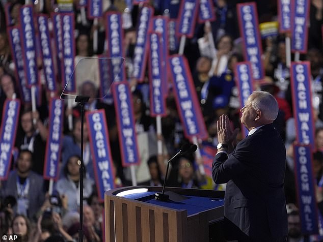 Walz's speech was heavy on football metaphors and references to his time as a public school teacher. As he spoke, supporters in the crowd held signs that said 'Coach Walz'