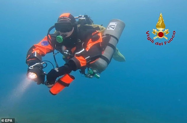 A handout video grab made available by Vigili del Fuoco (VVF), the Italian National Fire Brigade, shows rescue personnel of the special unit of divers of the National Fire Brigade and divers of the Italian fire brigade resuming inspections of the Bayesian yacht's wreck