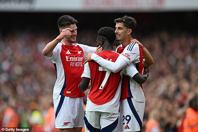 Kai Havertz (right) dinked the hosts in front after good work from Bukayo Saka (centre)