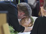 Goodbye, my love: Father says emotional farewell to his wife and three daughters killed by Putin missile strike as tearful crowd gathers outside church