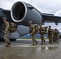 In this image released by the U.S. Air Force, U.S. Army Soldiers assigned to 1st Battalion, 501st Parachute Infantry Regiment, 2nd Infantry Brigade Combat Team (Airborne), 11th Airborne Division, board a U.S. Air Force C-17 Globemaster III assigned to the 176th Wing, Alaska Air National Guard, as part of a force projection exercise to Shemya Island, Alaska, at Joint Base Elmendorf-Richardson, Alaska, Sept. 13, 2024. (Airman 1st Class Hunter Hites/U.S Air Force via AP)