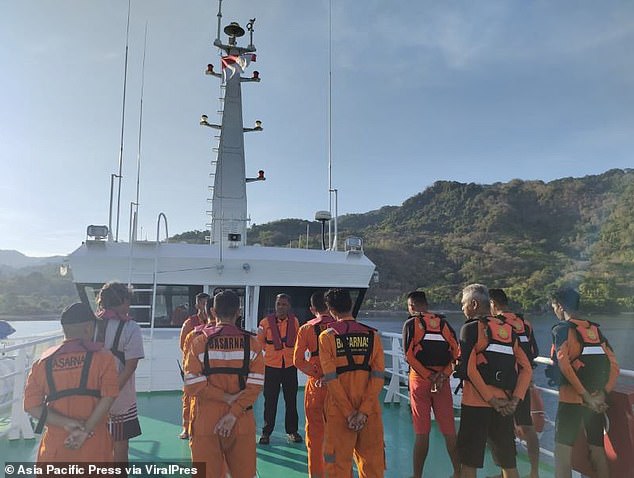 Rescuers are pictured during the multi-day search for Monfore, which was carried out around the waters of Reong Island using long boats or speed boats