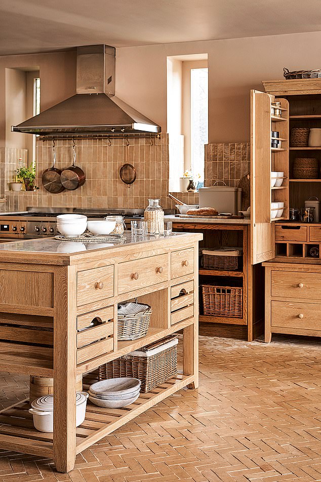 The plaster-coloured walls and whitewash finish to the oak give this traditional kitchen island (£1,250, cotswoldco.com) a modern air