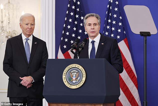 Secretary of State Antony Blinken introduces President Joe Biden for Biden's final foreign policy speech in the Ben Franklin Room at the State Department's Harry S. Truman headquarters building on January 13