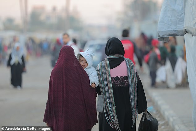 Palestinians displaced by the war and living in makeshift tents in Deir al-Balah, Gaza on January 13