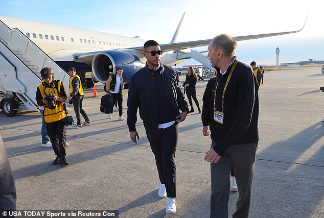 Notre Dame Fighting Irish head coach Marcus Freeman arrives at the airport in Atlanta