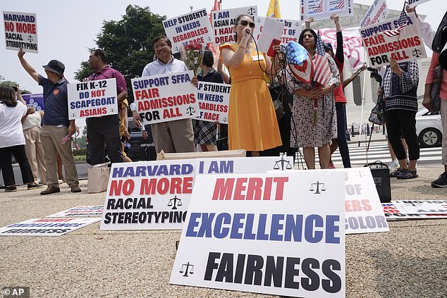 Protestors seen outside the Supreme Court in June 2023 after the court struck down affirmative action in college admissions, one of the first major hits to DEI practices under the Biden administration